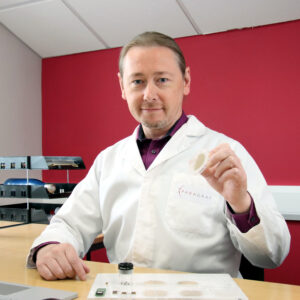 Paragraf CEO Simon Thomas holding wafer with graphene chips